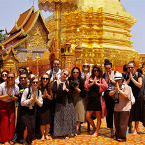 Explore Thailand while getting TEFL certified with Greenheart Travel group outside of gold monument in Thailand